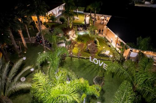 an aerial view of a house with a garden at night at Hotel San Luca in Battipaglia