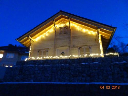 a building with christmas lights on the side of it at Ferienhaus Blick Hasserode in Wernigerode