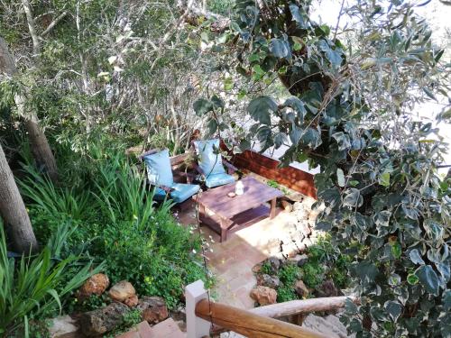 an overhead view of a table and chairs in a garden at Martins Apartment - Belch1952 in Lagos