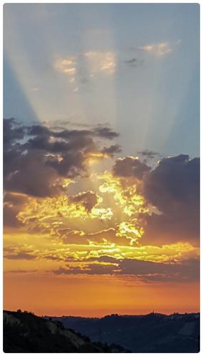 an image of a sunset with clouds in the sky at Tra mare e monti in Chieti
