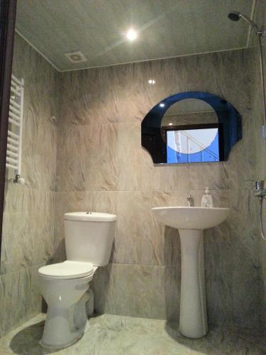 a bathroom with a toilet and a sink at Old Town Akhaltsikhe in Akhaltsikhe