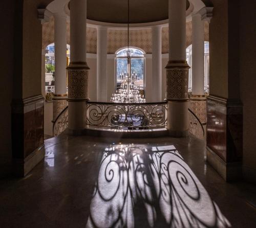 a shadow of a face on the floor of a building at Majestic Hotel in Tunis