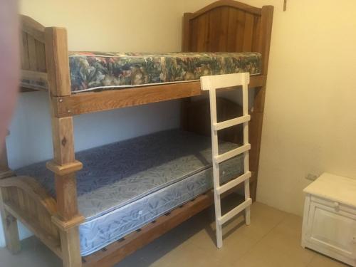 a couple of bunk beds in a room at CASA EN EL FRACCIONAMIENTO SAN FERNANDO 1 in Cuautlancingo