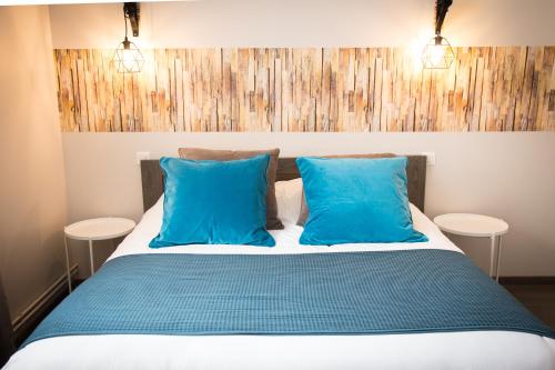 מיטה או מיטות בחדר ב-Villa Louis Victor