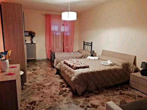 מיטה או מיטות בחדר ב-A Casa di Raffy