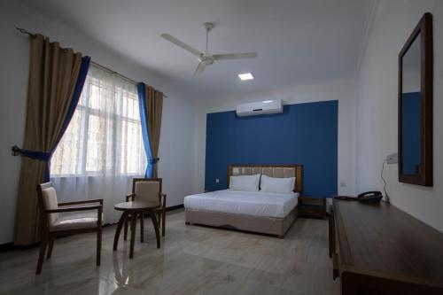 Postel nebo postele na pokoji v ubytování Home Station Hotel