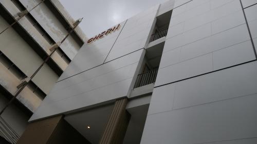 a building with a sign on the side of it at CHERN Bangkok in Bangkok