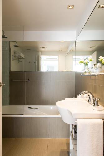 a bathroom with a sink and a mirror at Nuss Buenos Aires Soho in Buenos Aires