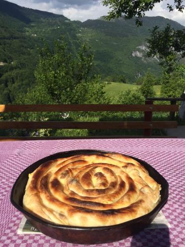a pie in a pan sitting on a table at Kljajevica Orchard in Pljevlja