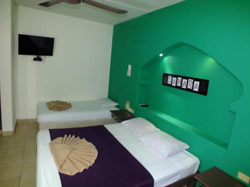 Una cama o camas en una habitación de Gran SAHARA