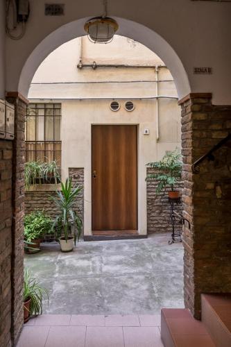 an entrance to a building with a wooden door at Borgo Pietralata in Bologna
