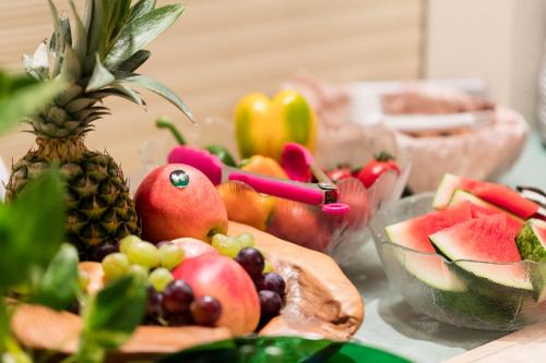 a bunch of fruits and vegetables on a table at Pension Zum lustigen Steirer in Bruck an der Mur