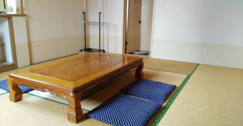 a wooden table sitting on the floor in a room at Myoko - Hotel / Vacation STAY 17055 in Myoko