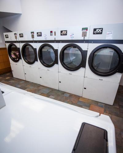 a row of washing machines in a laundrette at The Belvedere Hotel in New York