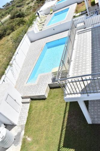 an aerial view of a house with a swimming pool at Brighthelm Villas in Pereybere