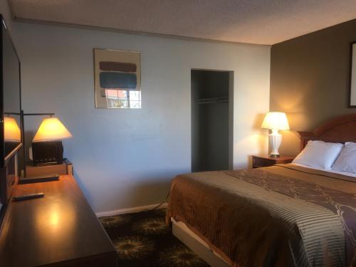 Letto o letti in una camera di Villa Park Motel