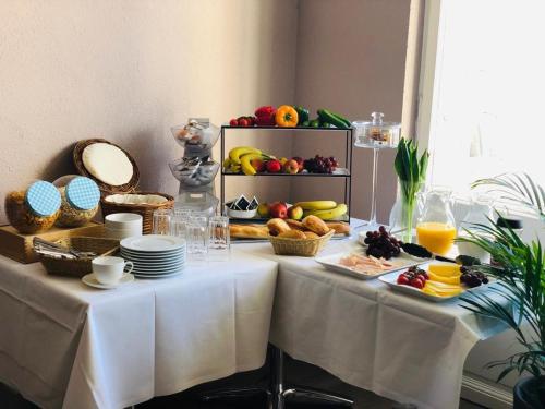 a table with a buffet of food on it at Motel Blue in Berlin