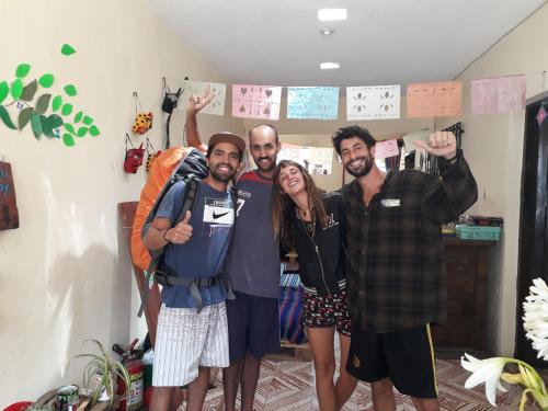 a group of three people posing for a picture at Casa Apapacho hostel in San Cristóbal de Las Casas