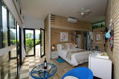 En eller flere senger på et rom på Hotel Casa Ambrosia