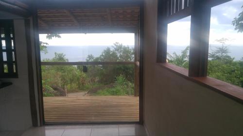 a room with a window with a view at Mirante in Trindade