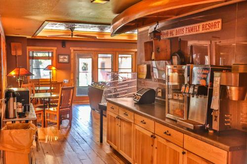 a kitchen with a counter and a table in a room at Good Ol Days Resort in Nisswa