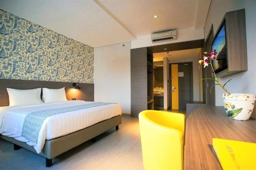 Tempat tidur dalam kamar di BW inn Belitung