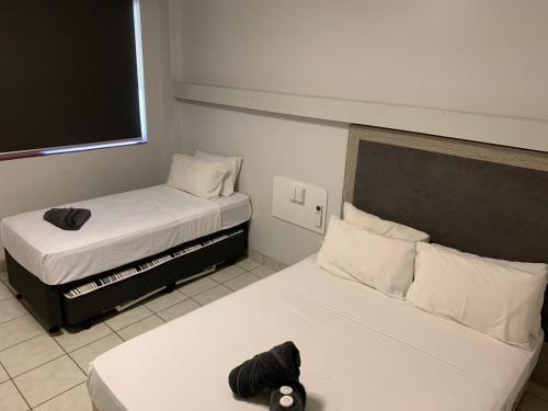 Un ou plusieurs lits dans un hébergement de l'établissement The Stuart Hotel-Motel