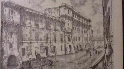a drawing of a street with people in front of buildings at Le antiche mura in Civitavecchia