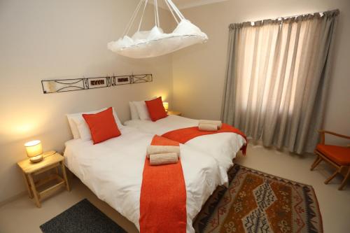 Posteľ alebo postele v izbe v ubytovaní Aloe Rock House