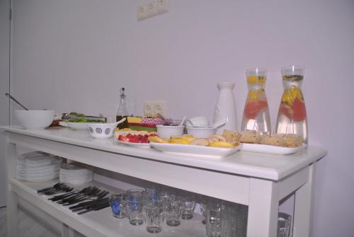 a buffet with food and drinks on a table at Hotel Casa calda in Kutaisi