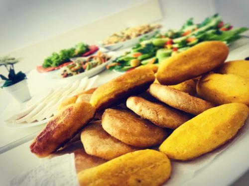 a plate of food with potatoes and vegetables on a table at Hotel Casa calda in Kutaisi