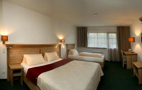 Voodi või voodid majutusasutuse Hotel Resort Stein toas