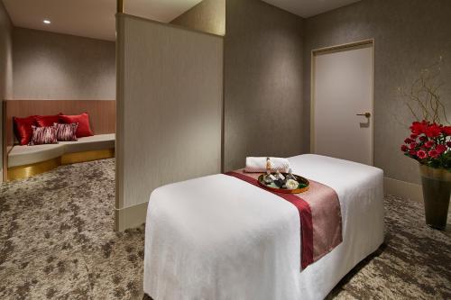 a room with a bed with a bowl of food on it at Cerulean Tower Tokyu Hotel, A Pan Pacific Partner Hotel in Tokyo