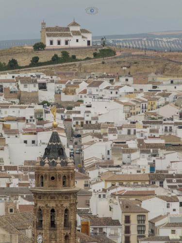 a view of a city with a clock tower at LA ATALAYA GREAT LUXURY ATTIC in Antequera