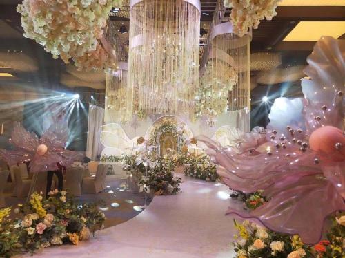a room with a bunch of flowers and chandeliers at The Anandi Hotel and SPA - Luxury Healing Hotel for Wellbeing in Shanghai