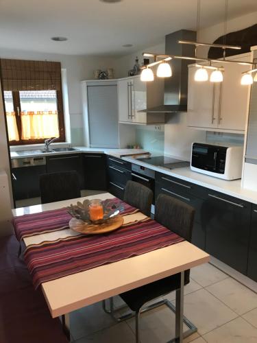 a kitchen with a table with a plate of food on it at Casa Mia in Sankt Georgen ob Murau