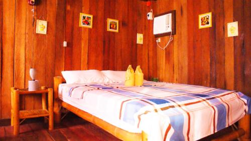 Ένα ή περισσότερα κρεβάτια σε δωμάτιο στο MLK Bamboo Beachhouse