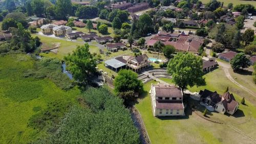 an overhead view of a house in a village at Floreat Riverside Lodge and Spa in Sabie