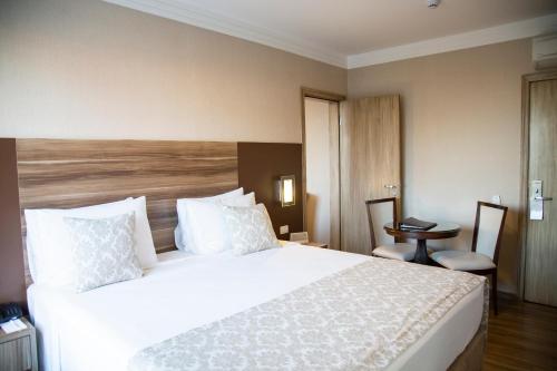 Hotel Florençaにあるベッド