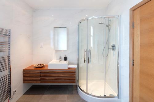 a bathroom with a shower and a sink at Hampden Apartments - The Charles in Windsor