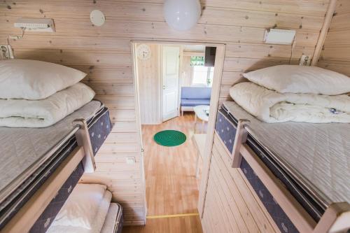 En eller flere senge i et værelse på Hafsten Resort