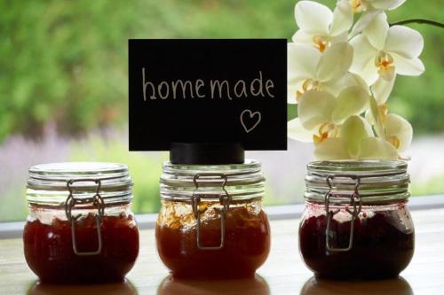 two mason jars filled with honey with a sign on it at Landhaus Pannonia in Mörbisch am See