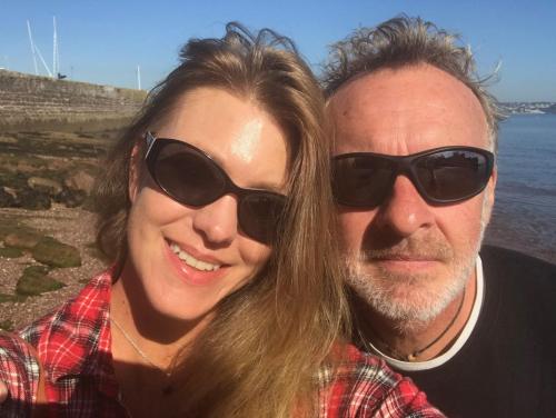a man and a woman wearing sunglasses posing for a picture at San Brelade in Paignton