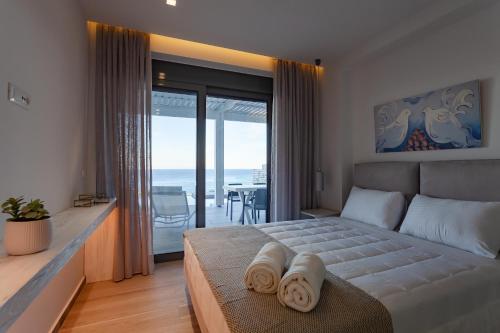 Ένα ή περισσότερα κρεβάτια σε δωμάτιο στο Villa Vrachos