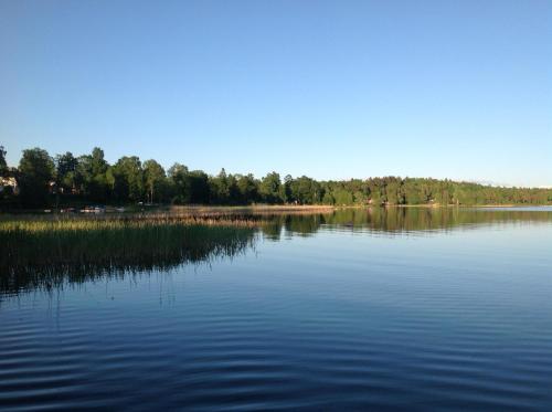 a large body of water with trees in the background at Örserumsbrunn Gestgifveri & Konferens in Gränna