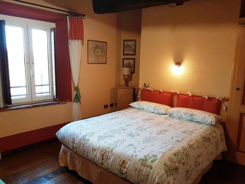 Ένα ή περισσότερα κρεβάτια σε δωμάτιο στο B&B La Cascina di Monia e Mario