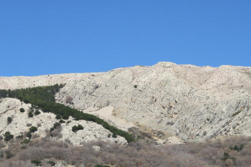 a view of a mountain with a road on it at Apartments Authentic Baska in Baška