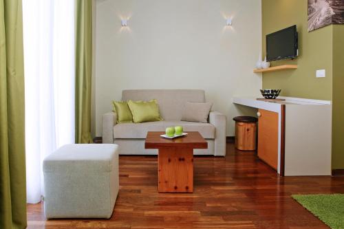 a living room with a couch and a table at Boutique Hotel Bol in Bol
