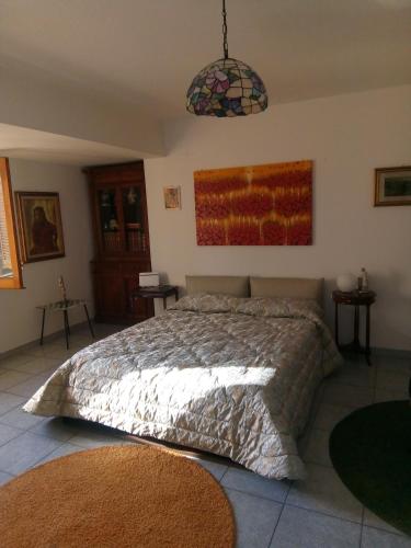 Ένα ή περισσότερα κρεβάτια σε δωμάτιο στο "Al Vecchio Studio"