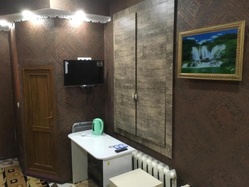 TV a/nebo společenská místnost v ubytování Hotel Triumph